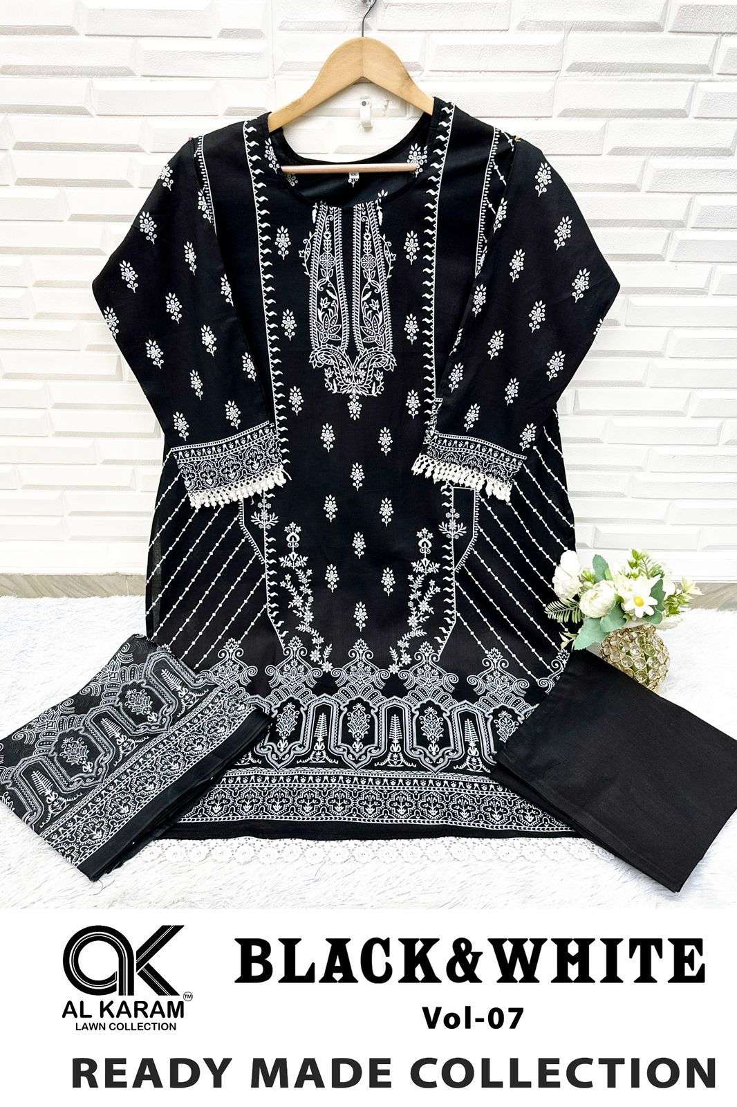 BLACK AND WHITE STICH SUITS READY WEAR BY AL KARAM-01