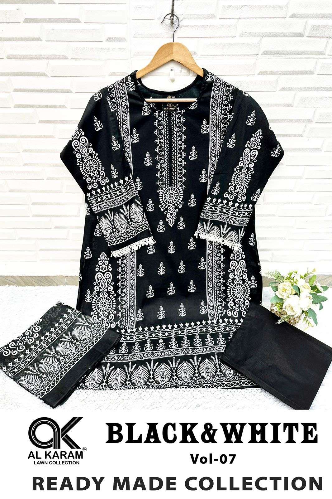 BLACK AND WHITE STICH SUITS READY WEAR BY AL KARAM-02