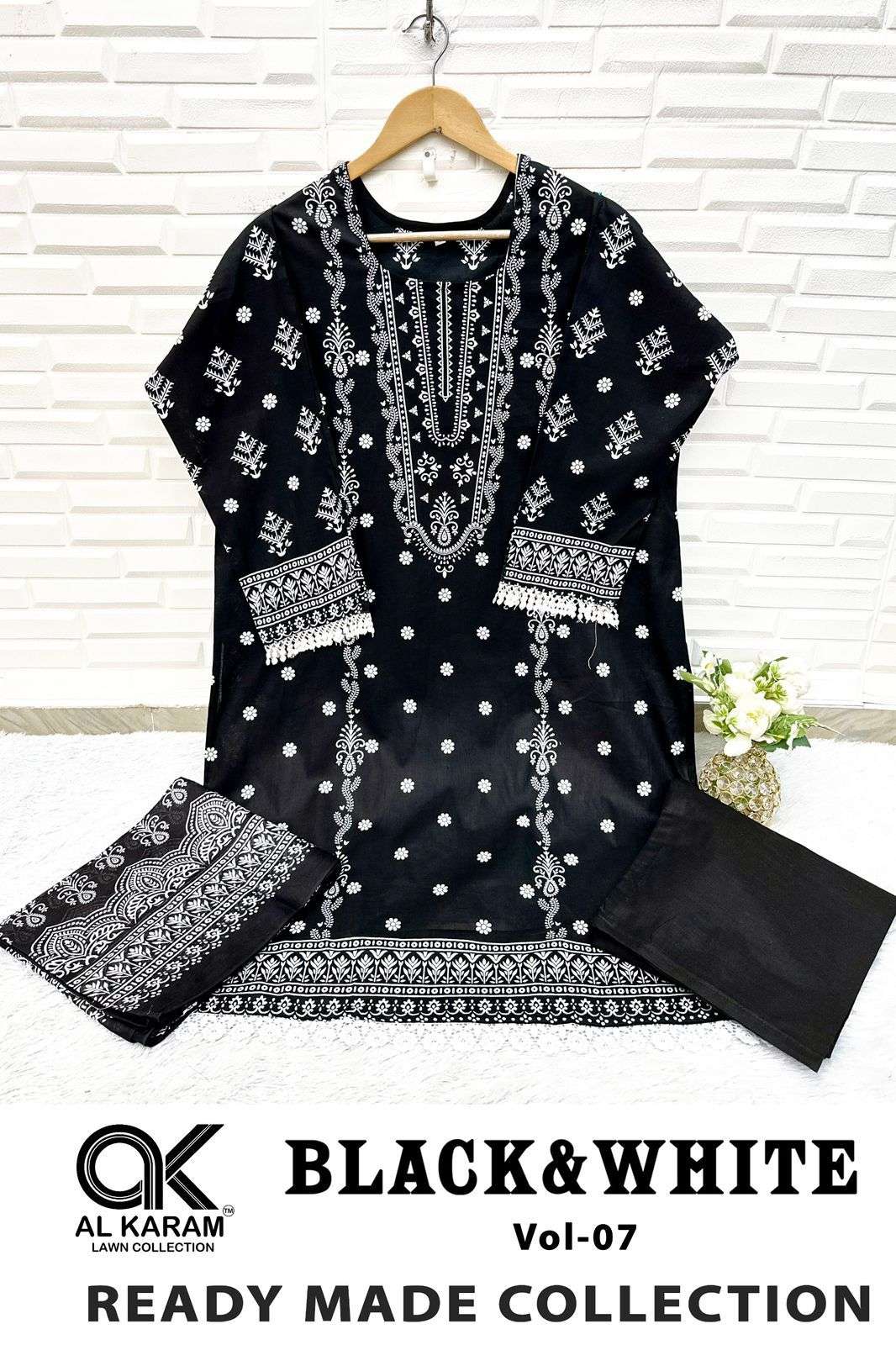 BLACK AND WHITE STICH SUITS READY WEAR BY AL KARAM-06